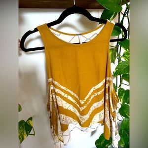 Breezy Free People shirt size XS, perfect for pairing with a bralette or bandeau